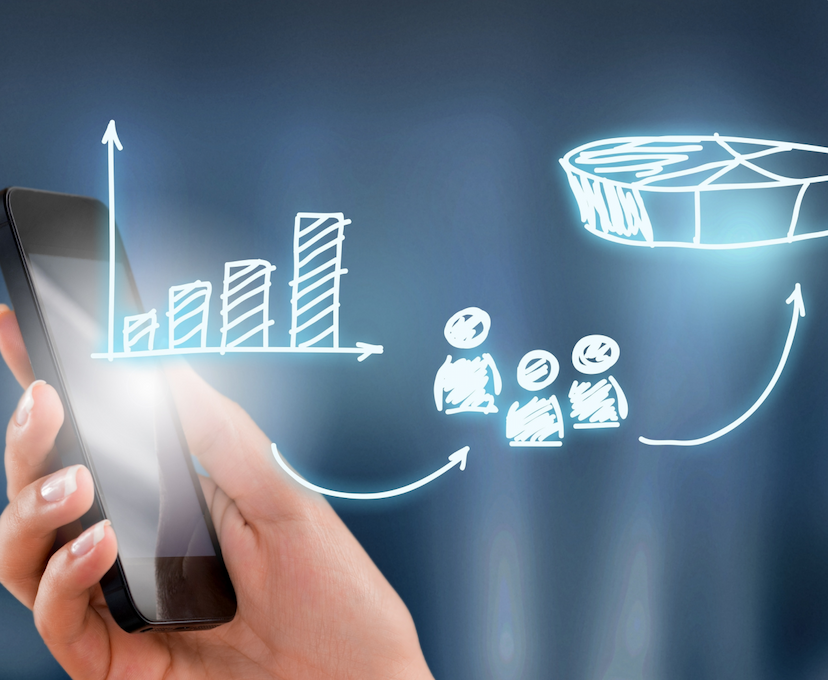 Hand holding a smartphone with digital charts, including bar graphs and a pie chart, appearing as overlays.